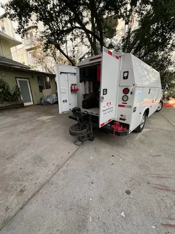 Magnet Plumbing service vehicle on-site for Grease Trap Cleaning in Pinecrest Forest